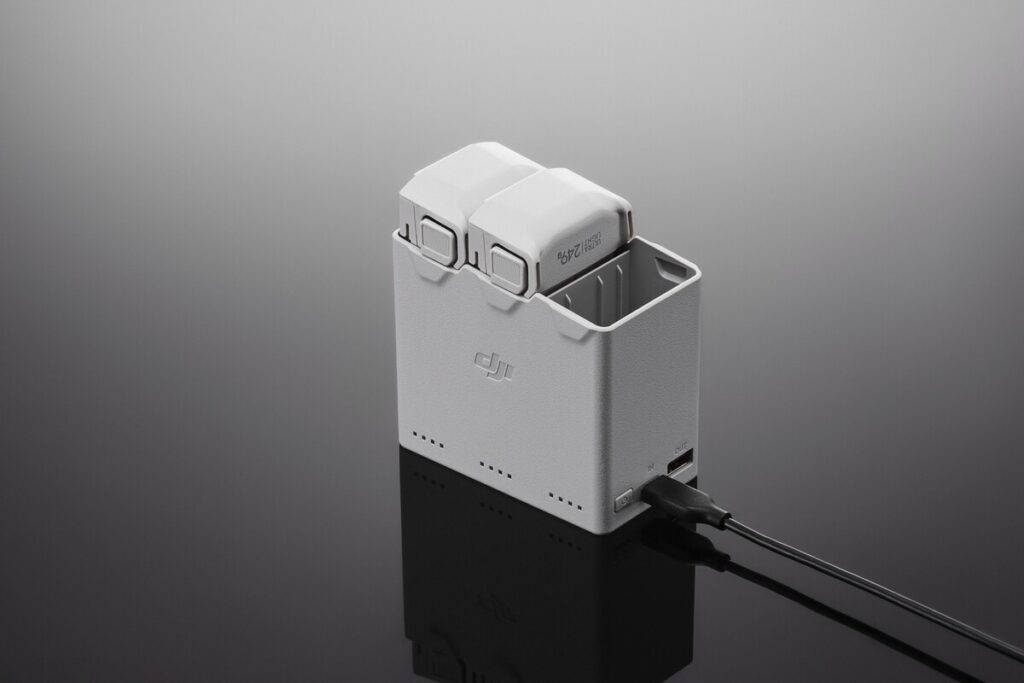 DJI Mini 4 / Mini 3 Series Two-Way Charging Hub with three battery slots, side view.