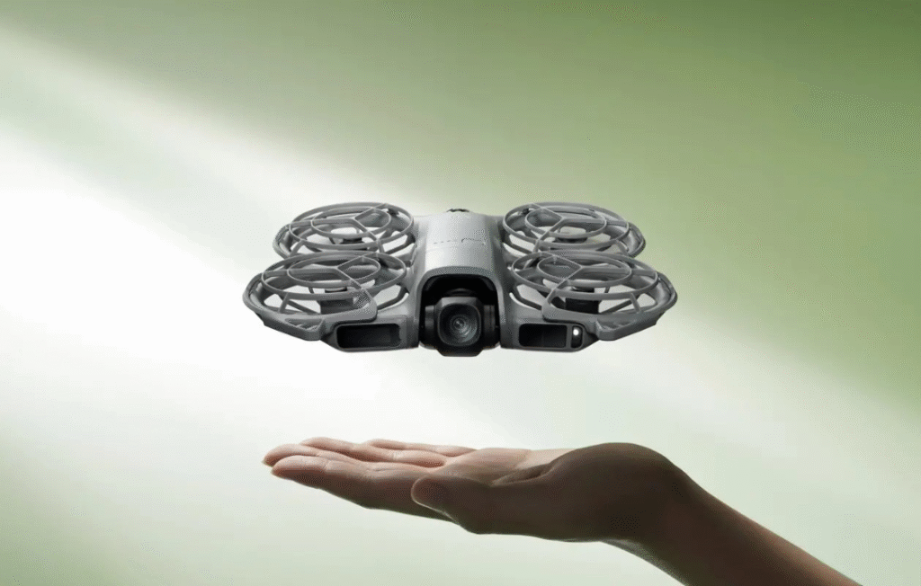 DJI Neo 2 Fly More Combo drone hovering over a scenic landscape during golden hour.