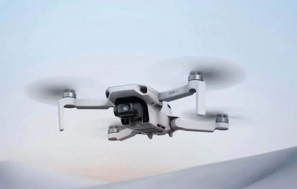 DJI Mini 4K Fly More Combo ultra-light drone on table with controller and batteries