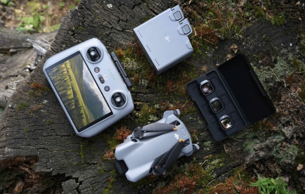 DJI Mini 5 Pro Fly More Combo (RC 2) drone with RC 2 controller, batteries and charging hub arranged on a table