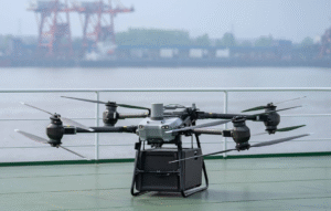 DJI FlyCart 30 Combo heavy-lift delivery drone in flight, showing industrial payload setup