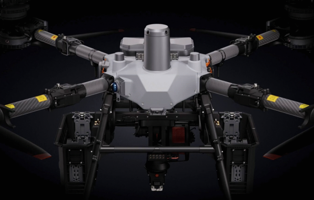 DJI FlyCart 100 heavy-lift drone in flight with cargo payload — industrial drone for logistics and emergency operations