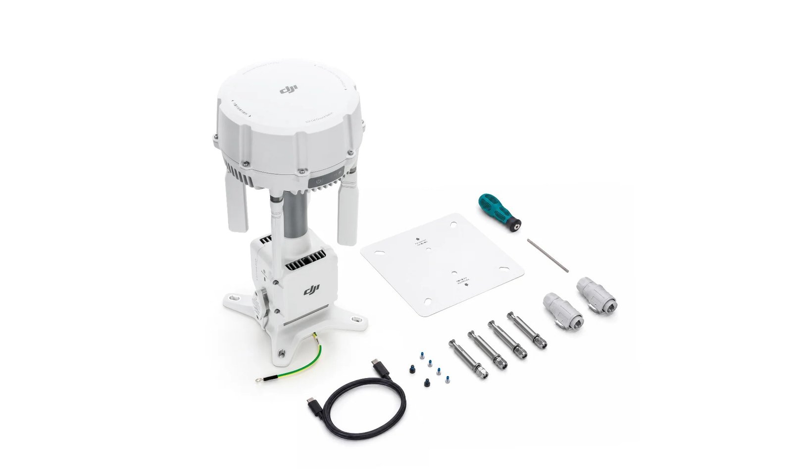 High-angle overview of the main unit alongside its full unboxed installation kit, including a mounting plate, screwdriver, cables, and heavy-duty screws - DJI O4 Ground Station
